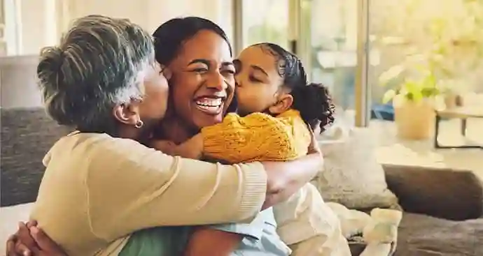 Grandma and daughter kissing mom