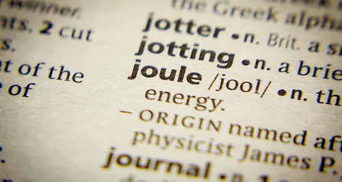A close-up of a dictionary displaying various words on its open pages.