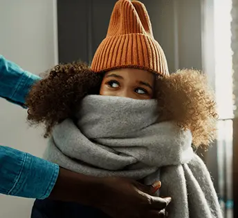 little girl bundled in winter gear. 