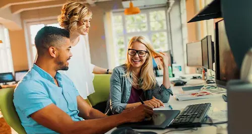 A woman smiles while holding a bag filled with clothes, showcasing her joy and excitement.