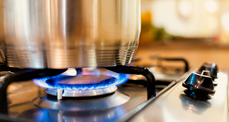 close up of pot on natural gas burner