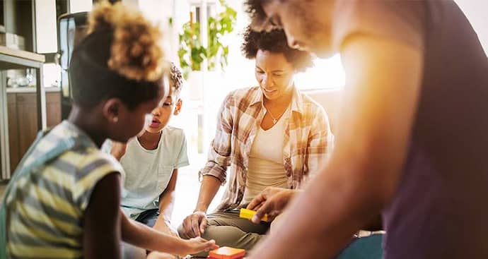 family playing Jenga together