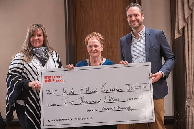Volunteer Citizen of the year for 2022 Janet Townsend with two Direct Energy reps.