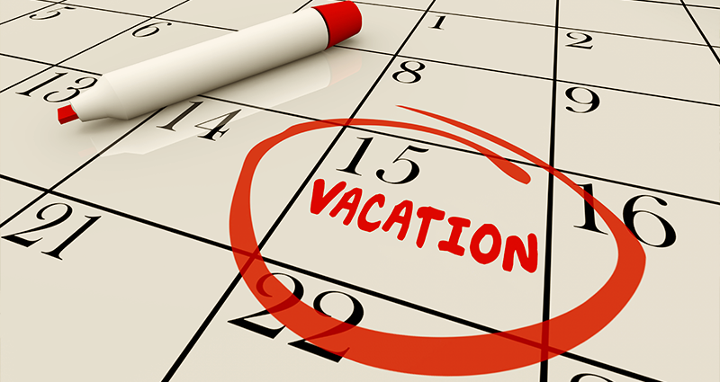 Close up of calendar with 15th circled and vacation written underneath