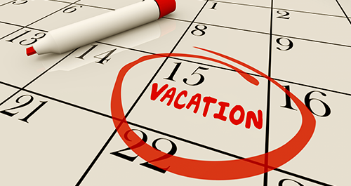 Close up of calendar with 15th circled and vacation written underneath