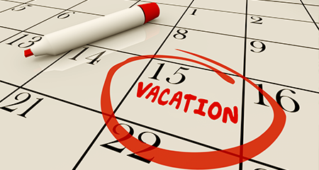 Close up of calendar with 15th circled and vacation written underneath