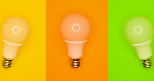 Image of three lightbulbs on different colours