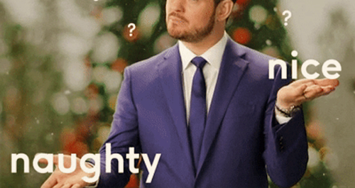 Michael Buble shrugging with naughty and nice words
