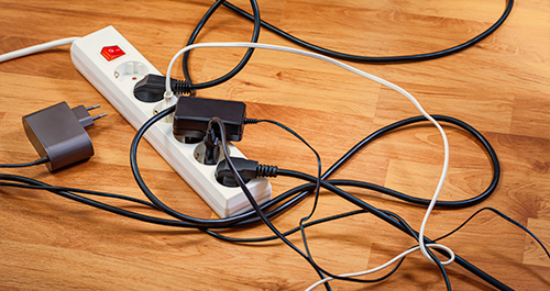 Photo of power bar with plug-ins on floor