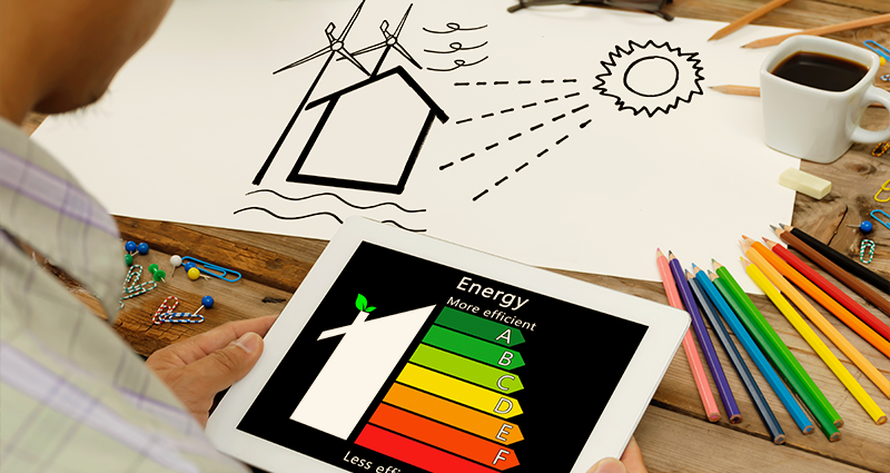 Person with tablet of energy uses with picture, coffee, and coloured pencils on table