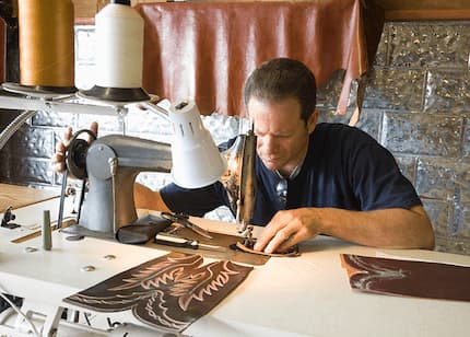 man using a sewing machine